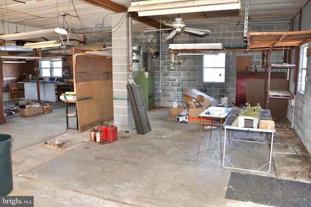 interior space with ceiling fan