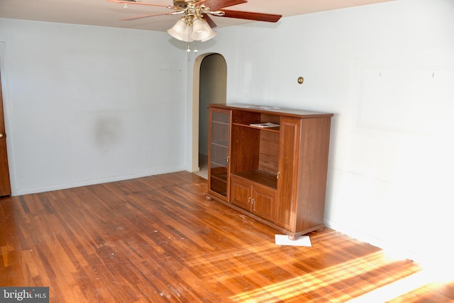 interior space with ceiling fan and hardwood / wood-style floors