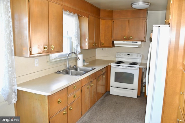 kitchen featuring white appliances and sink