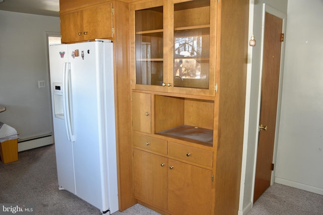 kitchen with white refrigerator with ice dispenser, a baseboard radiator, and light colored carpet