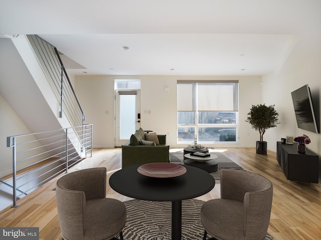 dining space with light wood-type flooring