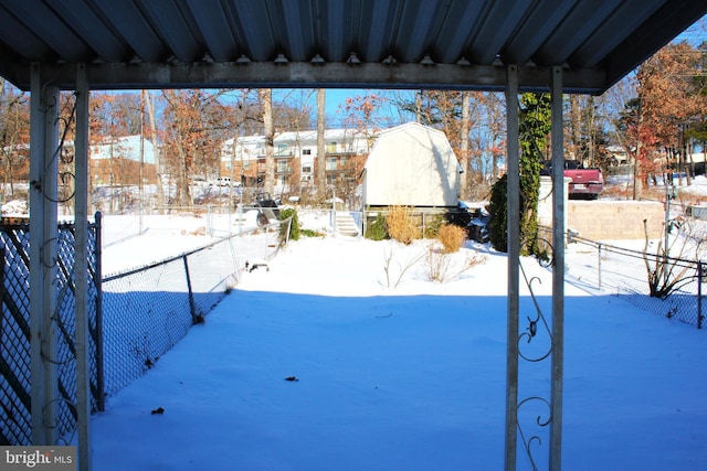 view of yard layered in snow