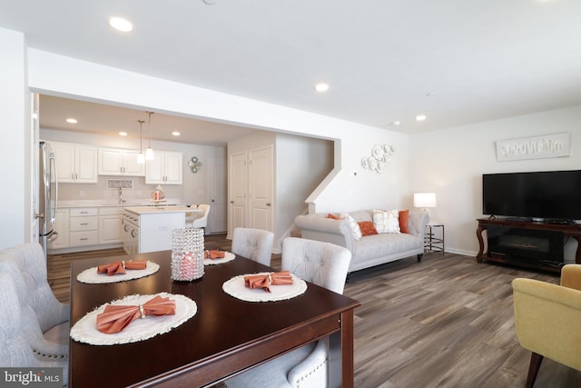 dining space featuring hardwood / wood-style flooring