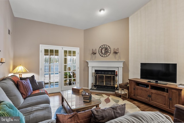 living room with hardwood / wood-style floors and french doors