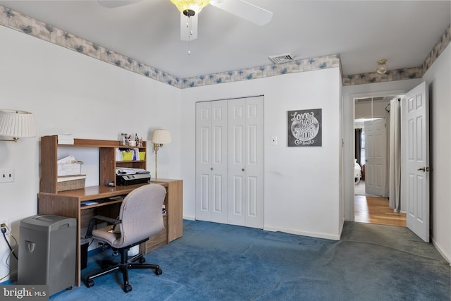 carpeted office with ceiling fan