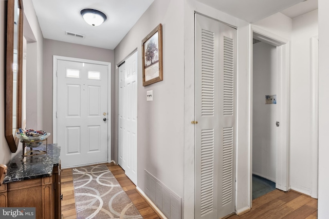 doorway to outside featuring wood-type flooring