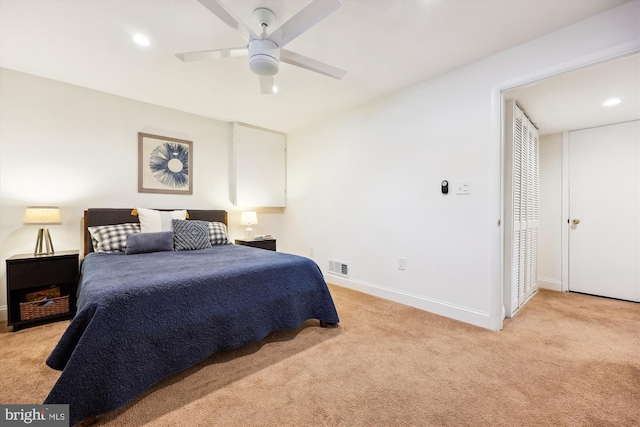 bedroom featuring ceiling fan and light carpet