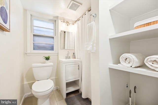 bathroom with tile patterned floors, vanity, toilet, and a shower with shower curtain