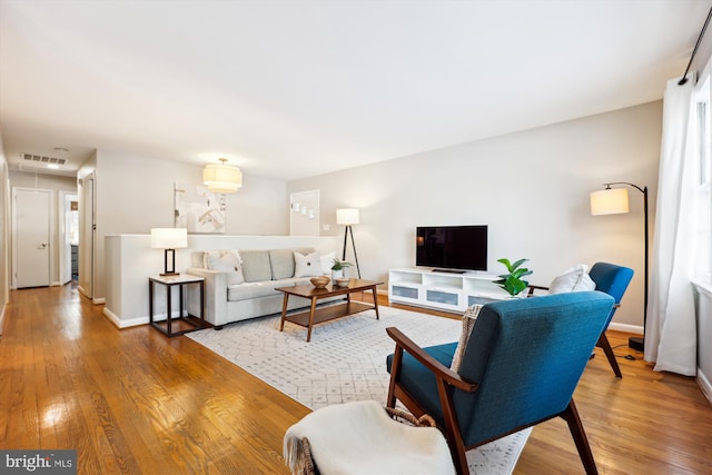 living room with light hardwood / wood-style floors