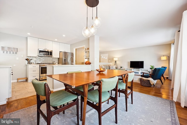 dining space featuring light hardwood / wood-style flooring