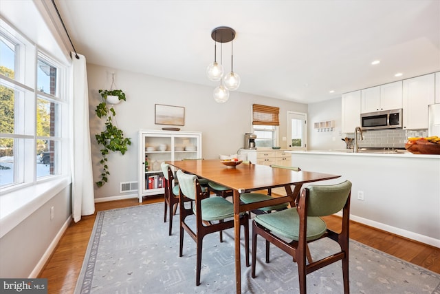 dining space featuring light hardwood / wood-style floors