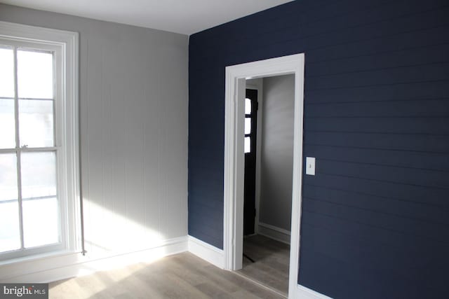 unfurnished room featuring hardwood / wood-style flooring