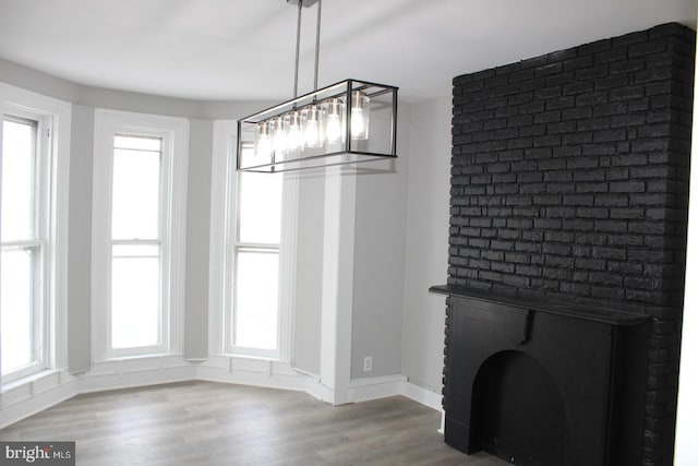 unfurnished dining area featuring hardwood / wood-style flooring