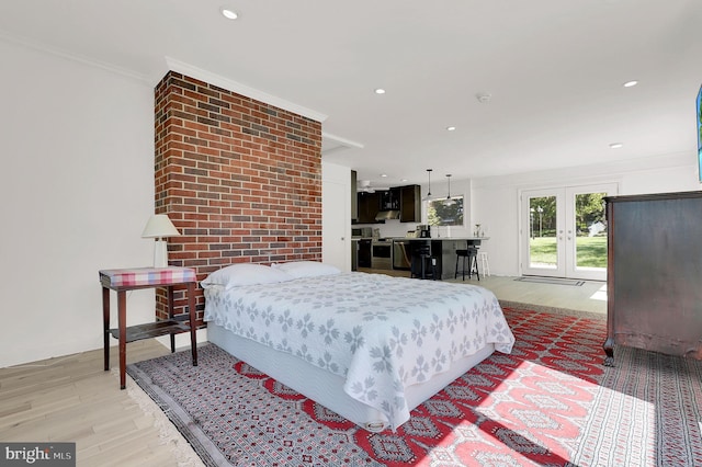bedroom with french doors, light wood-type flooring, recessed lighting, and ornamental molding