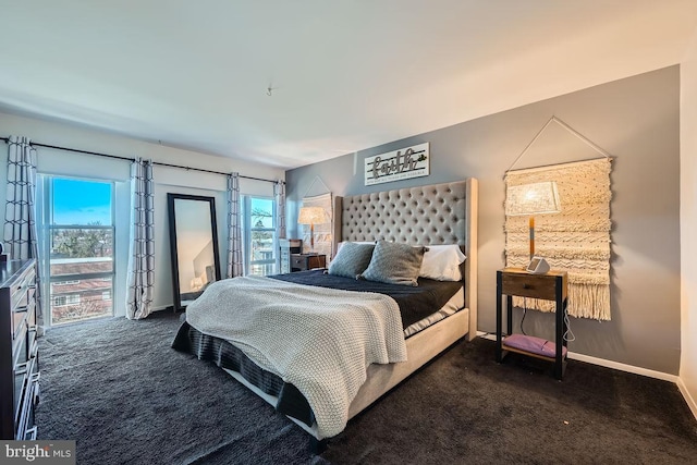 bedroom featuring dark colored carpet