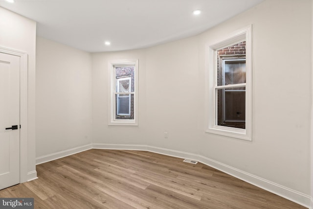 unfurnished room featuring light hardwood / wood-style flooring