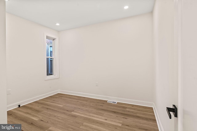 empty room featuring wood-type flooring