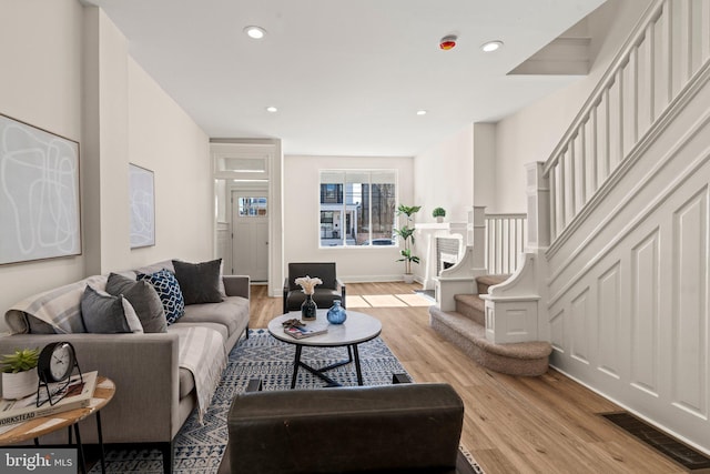 living room with light hardwood / wood-style flooring