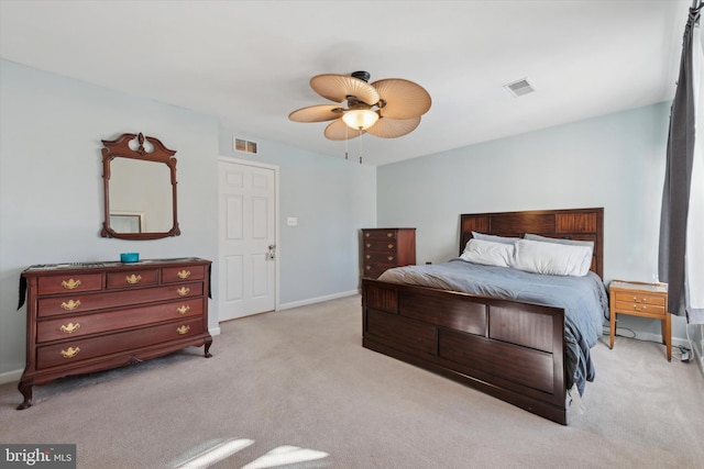 bedroom featuring light carpet, baseboards, visible vents, and ceiling fan