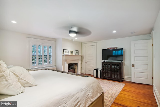 bedroom with ceiling fan and light wood-type flooring