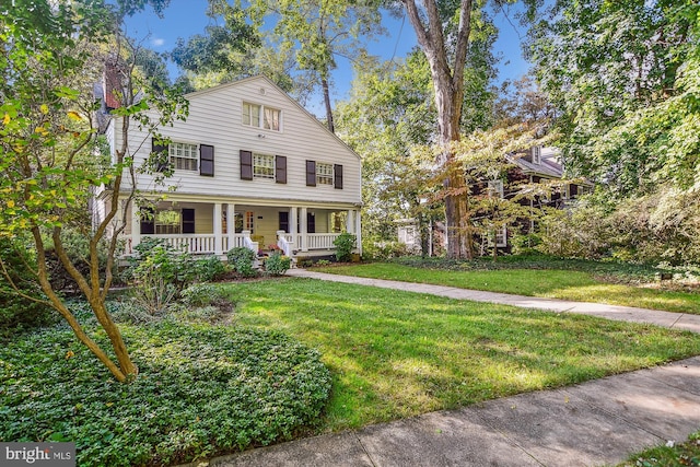 view of front of home with a front lawn and covered porch