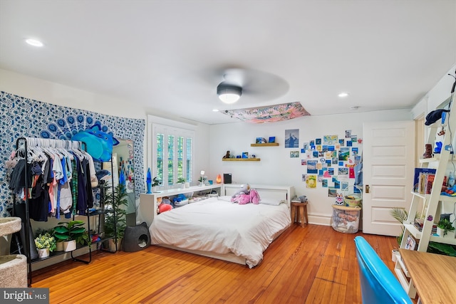 bedroom featuring ceiling fan and hardwood / wood-style floors