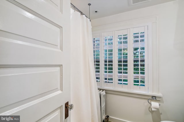 bathroom featuring radiator