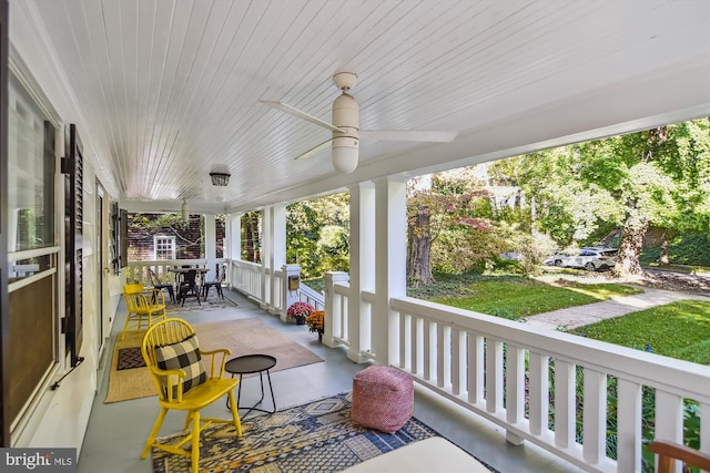 exterior space featuring ceiling fan and a porch