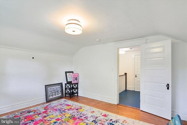 bonus room featuring vaulted ceiling and hardwood / wood-style floors