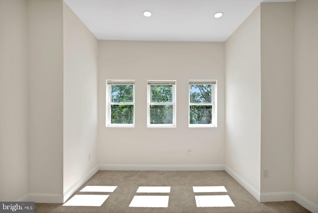 empty room with light colored carpet