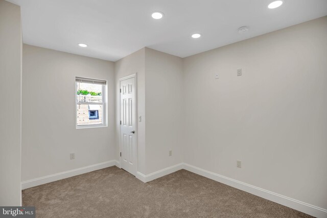 empty room with carpet flooring