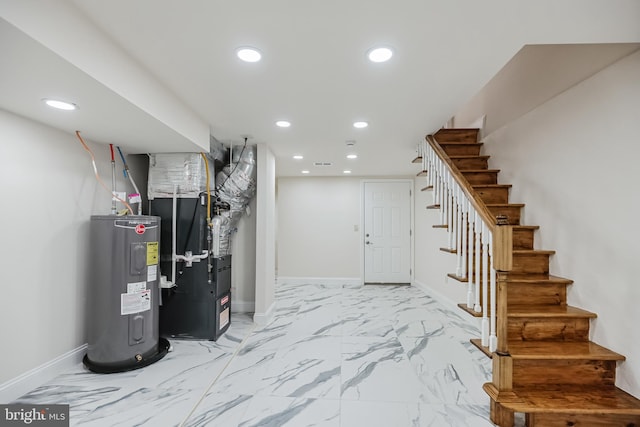 basement with heating unit and electric water heater