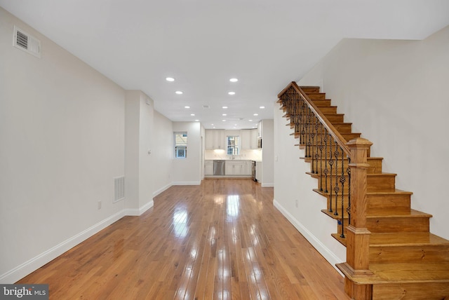 unfurnished living room featuring light hardwood / wood-style flooring