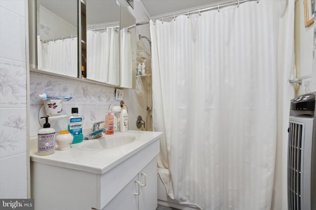 bathroom featuring radiator heating unit, vanity, and a shower with shower curtain