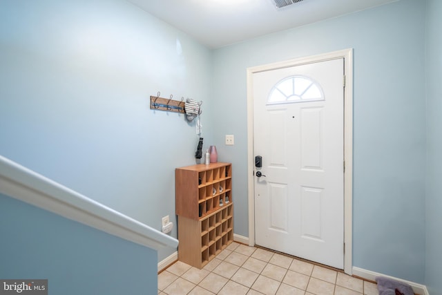 foyer entrance featuring light tile patterned floors