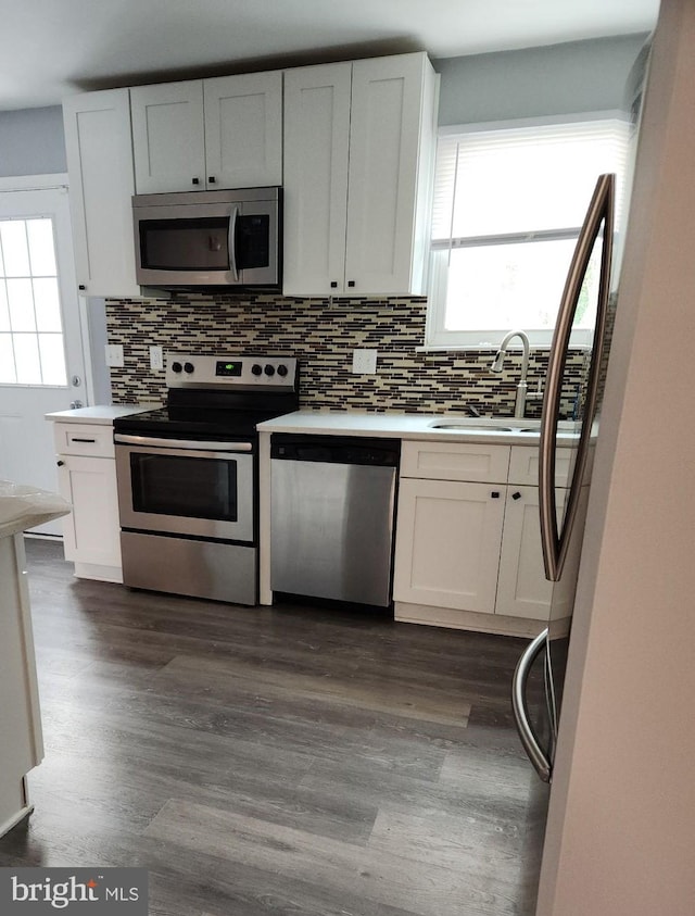 kitchen featuring white cabinetry, appliances with stainless steel finishes, and sink