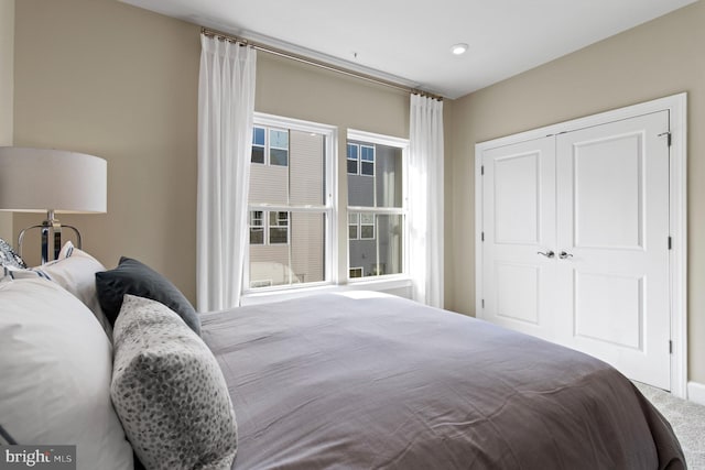 bedroom with a closet and carpet floors