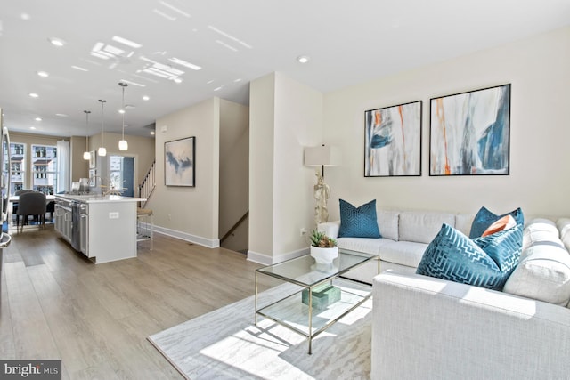 living room with light hardwood / wood-style flooring