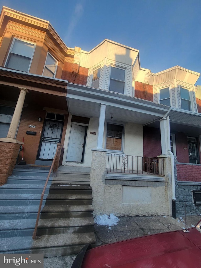 view of property with covered porch