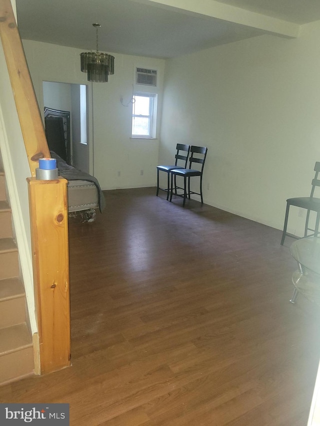 interior space featuring dark hardwood / wood-style flooring and a chandelier