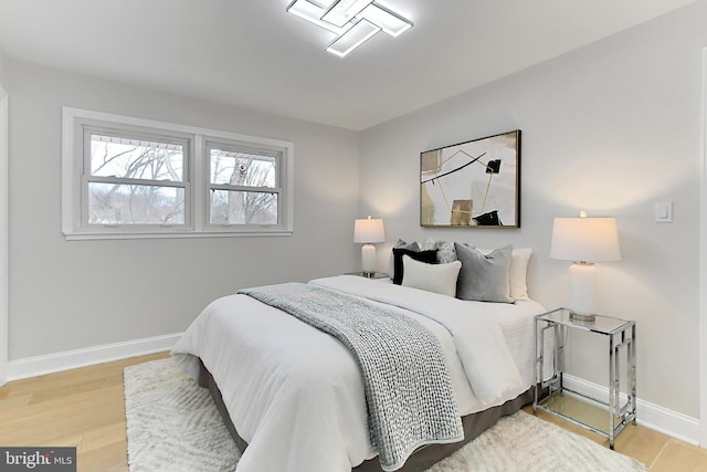 bedroom with hardwood / wood-style floors