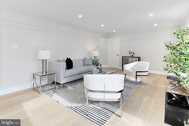 living room with light hardwood / wood-style flooring