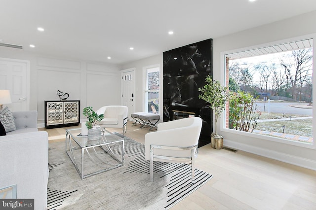 living room with light hardwood / wood-style flooring