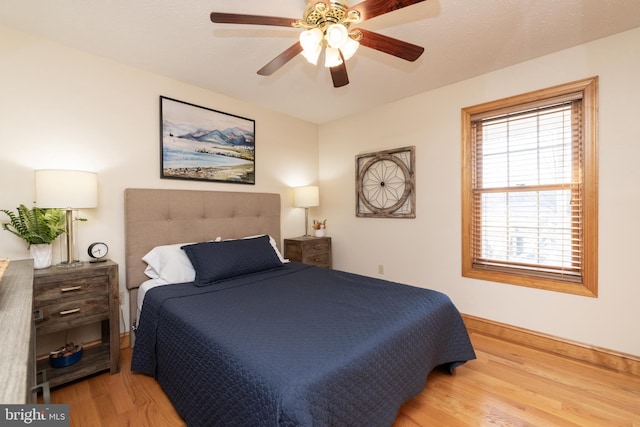 bedroom featuring hardwood / wood-style flooring and ceiling fan