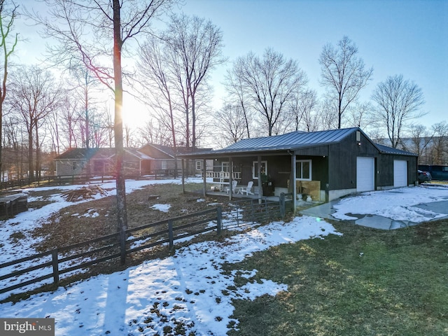 view of front facade with a garage and covered porch