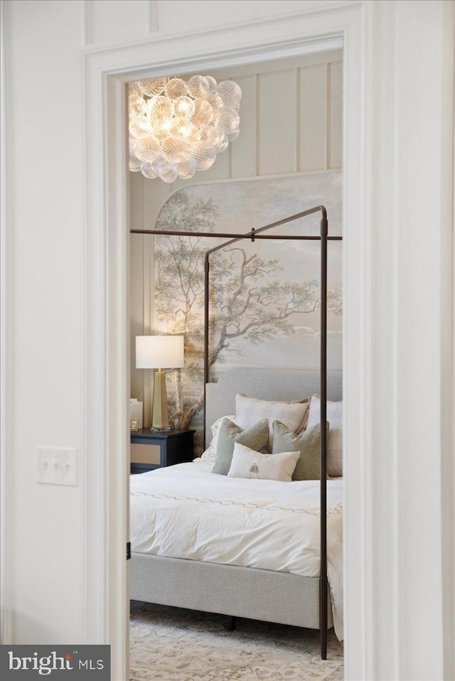 bedroom featuring a chandelier