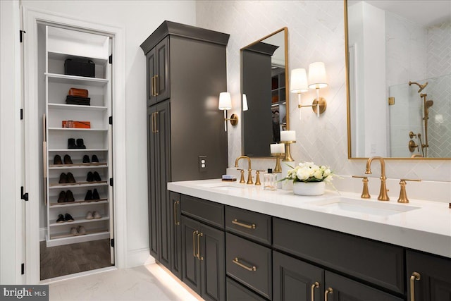 bathroom with a shower and vanity