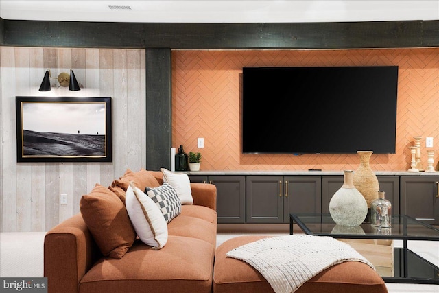 living room featuring wood walls