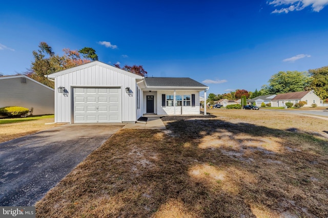 view of front of home featuring covered porch and a garage