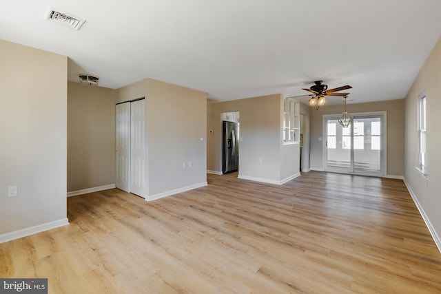 spare room featuring ceiling fan and light hardwood / wood-style flooring